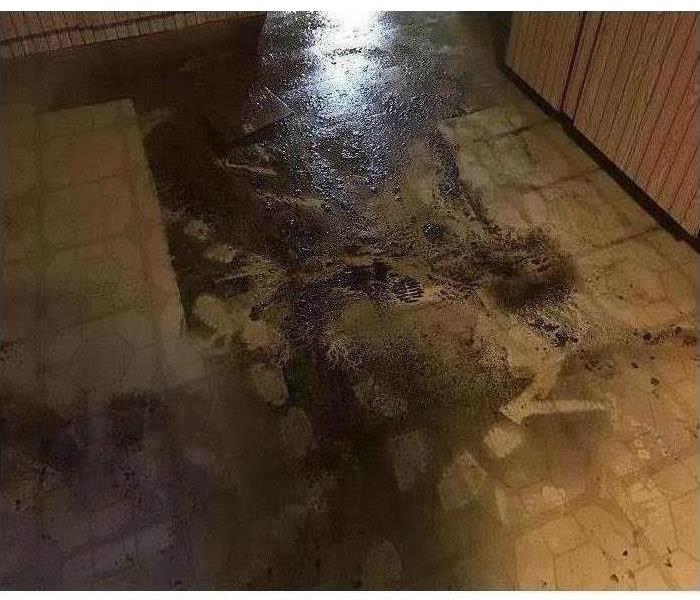 Sewage water on a tile floor